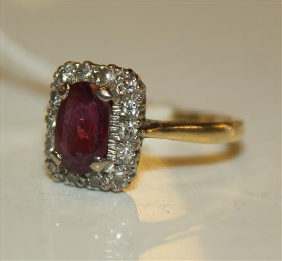 An 18ct gold ruby and diamond cluster ring